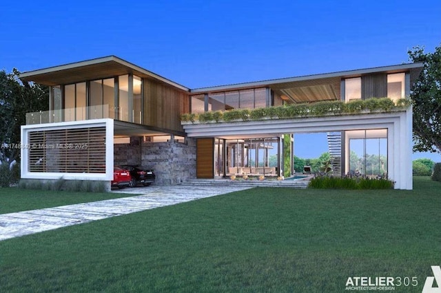 back of house with stone siding and a yard