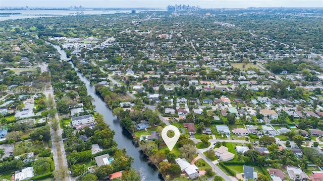 bird's eye view featuring a residential view and a water view