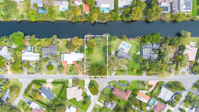 aerial view with a residential view and a water view