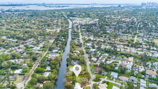 drone / aerial view with a water view and a residential view