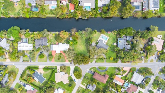 bird's eye view featuring a water view and a residential view