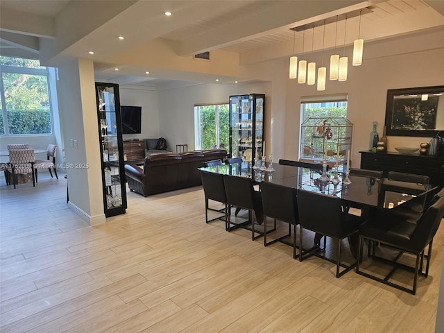 dining space with beam ceiling, recessed lighting, visible vents, light wood-style floors, and baseboards