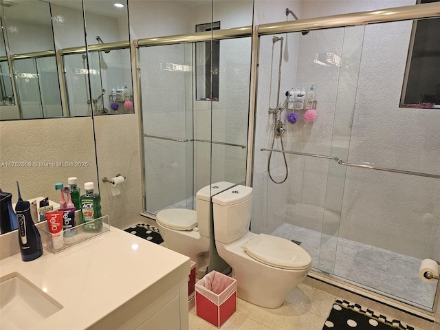 full bath with toilet, a shower stall, and vanity