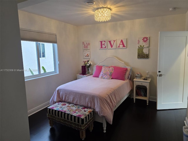 bedroom featuring dark wood-style floors and baseboards