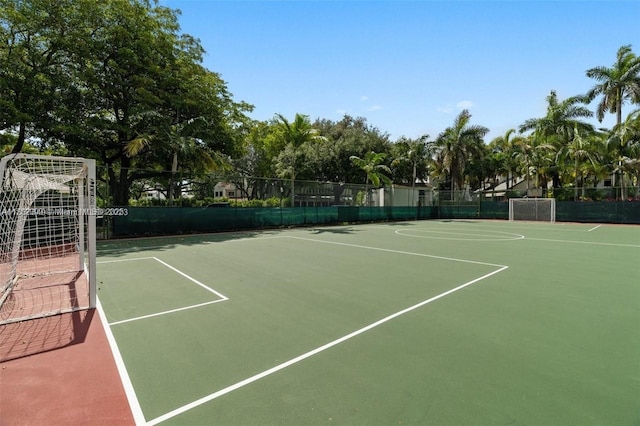 view of tennis court with fence