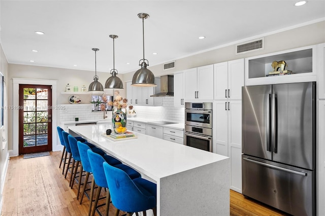 kitchen featuring open shelves, light countertops, white cabinetry, and stainless steel appliances