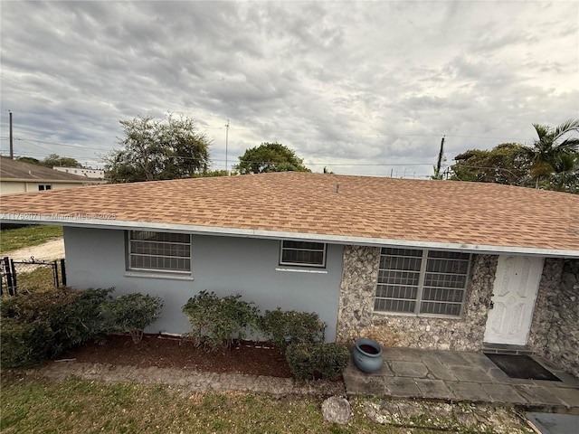 5360 Fletcher St, Hollywood, FL 33021 - back of property featuring stucco siding, fence, and a shingled roof