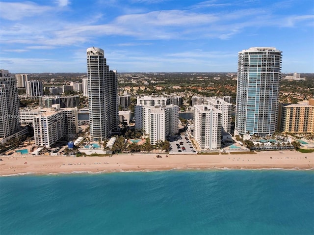 exterior space featuring a water view and a view of the beach