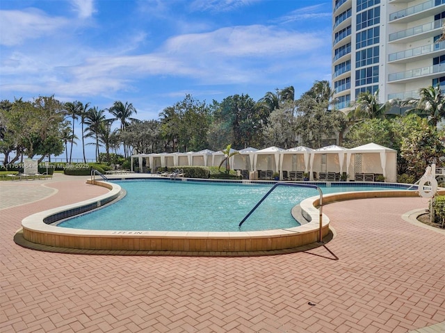 community pool featuring a patio area