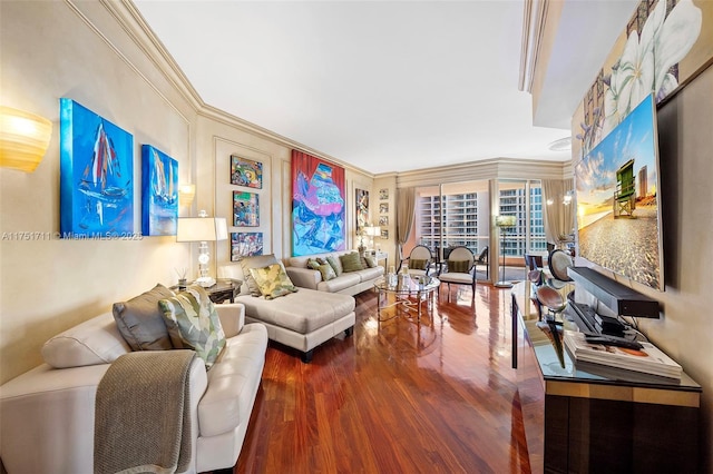 living room with ornamental molding and wood finished floors