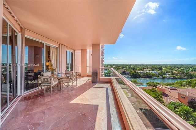 balcony featuring a water view