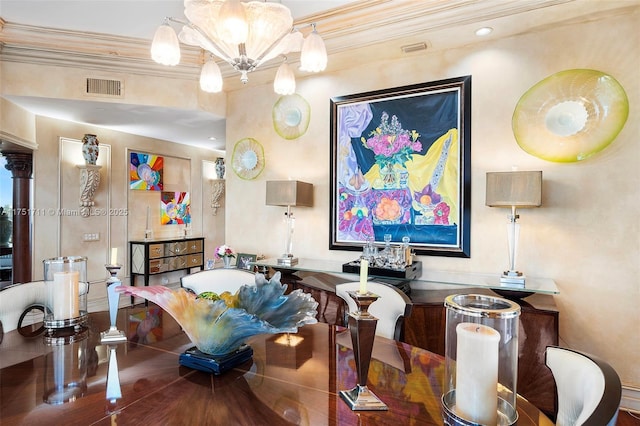 dining room featuring ornamental molding, visible vents, and an inviting chandelier