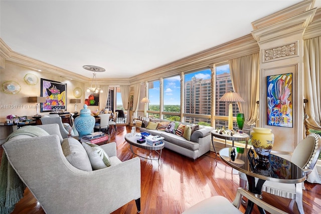 living area with ornamental molding and wood finished floors