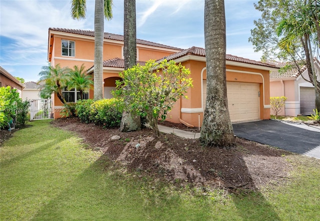 view of front of property featuring a tiled roof, an attached garage, aphalt driveway, stucco siding, and a front lawn