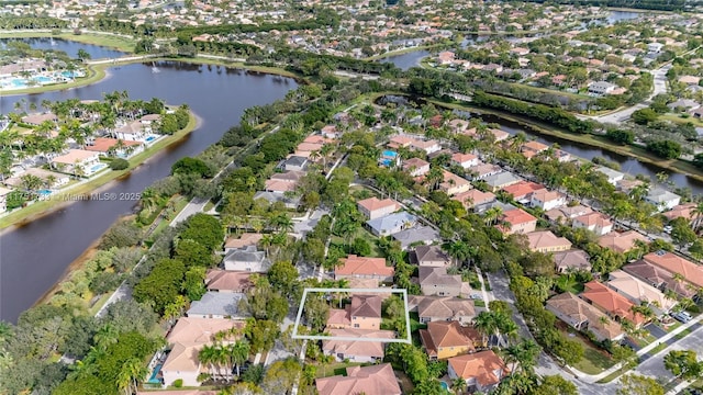 birds eye view of property featuring a residential view and a water view