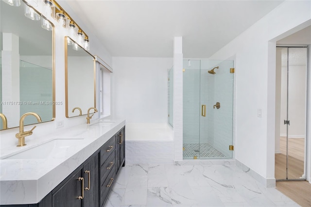 full bathroom with a sink, double vanity, marble finish floor, and a stall shower