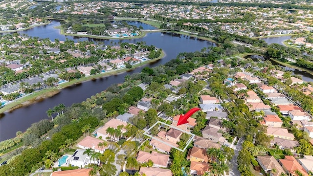 birds eye view of property with a water view and a residential view