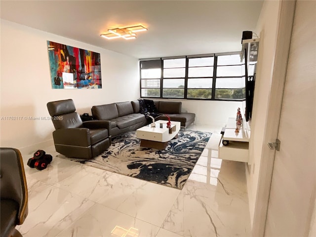 living area featuring marble finish floor