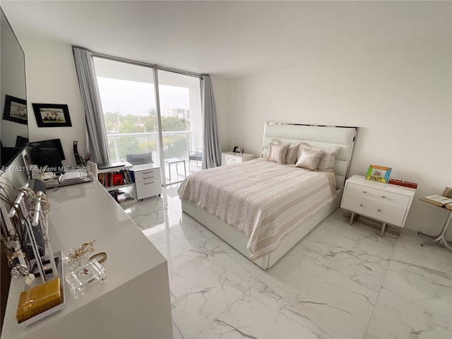 bedroom featuring access to exterior, expansive windows, and marble finish floor