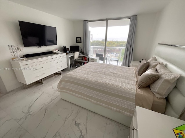 bedroom featuring access to exterior and marble finish floor