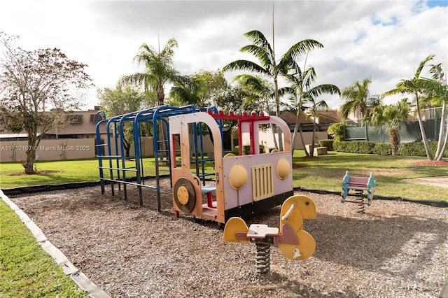 community jungle gym featuring a yard