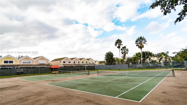 view of sport court with fence