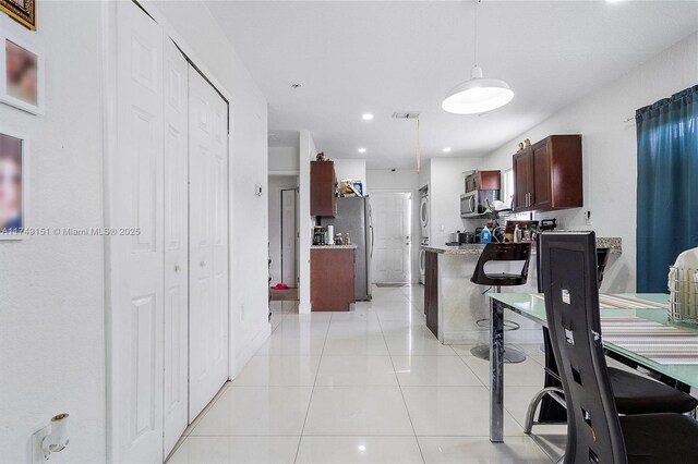 kitchen with visible vents, recessed lighting, stainless steel appliances, light countertops, and light tile patterned floors