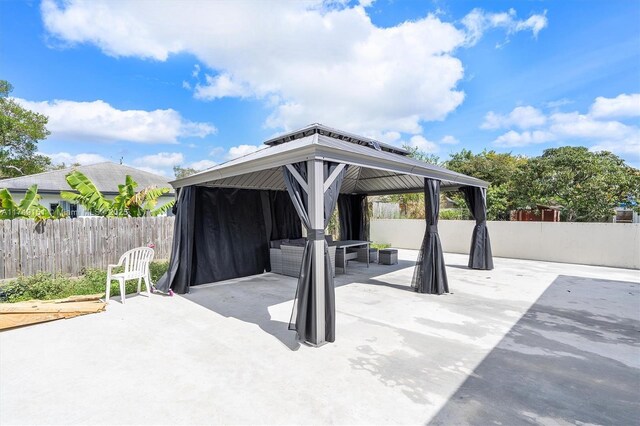 view of patio featuring a gazebo and fence