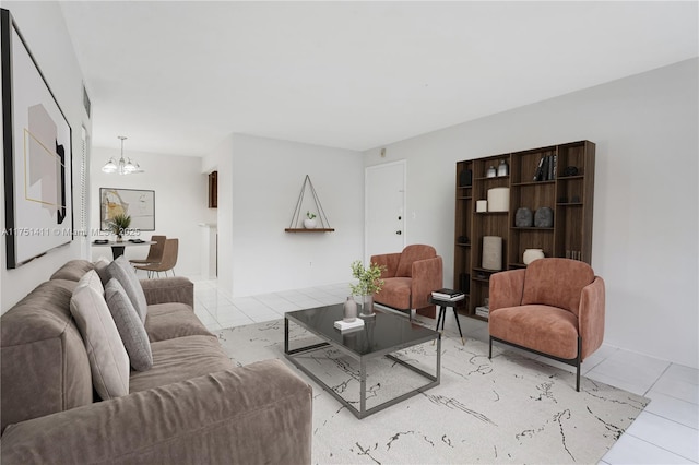 living room featuring light tile patterned floors and a notable chandelier