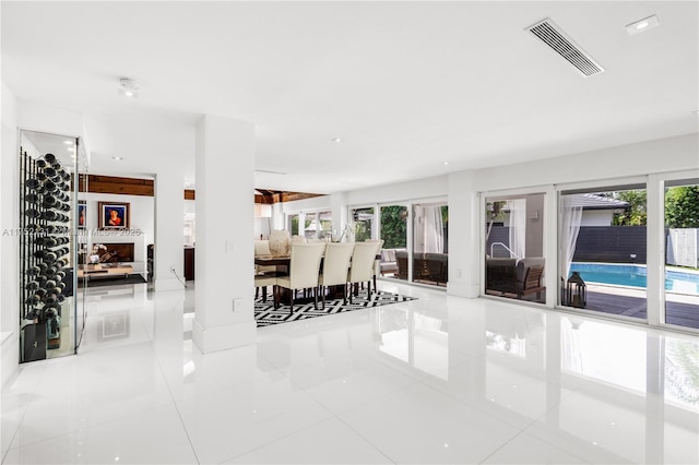 dining area featuring light tile patterned floors and visible vents