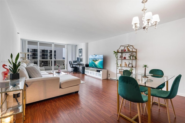 living area featuring dark wood-type flooring and a notable chandelier