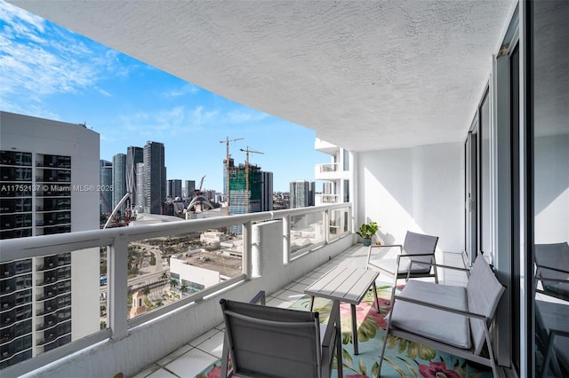 balcony featuring a city view