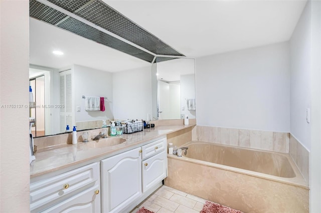 full bathroom featuring a bath, tile patterned flooring, a closet, and vanity