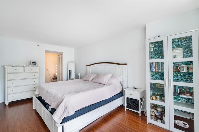 bedroom featuring dark wood-type flooring