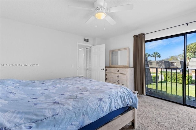 carpeted bedroom with access to outside, visible vents, and ceiling fan