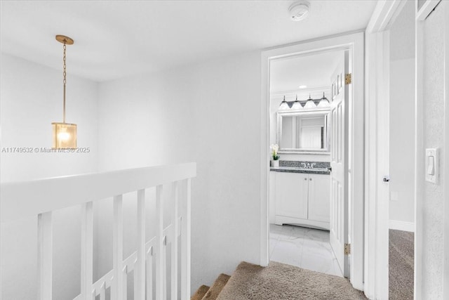 corridor featuring marble finish floor