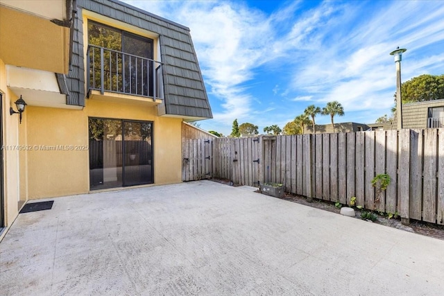 view of patio featuring fence