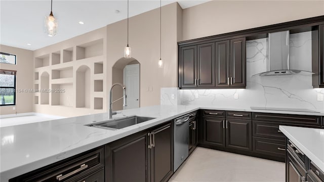 kitchen with hanging light fixtures, wall chimney exhaust hood, black electric cooktop, and a sink