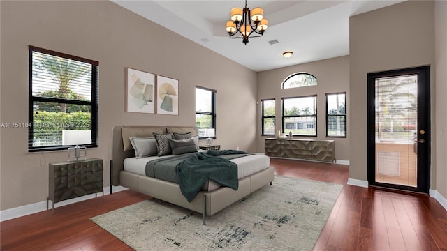 bedroom with baseboards, visible vents, a chandelier, and dark wood-style flooring