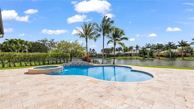 view of pool featuring a water view, a pool with connected hot tub, fence, and a patio