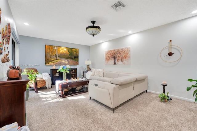 living room featuring light carpet, visible vents, baseboards, and recessed lighting