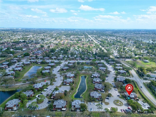 birds eye view of property featuring a water view and a residential view