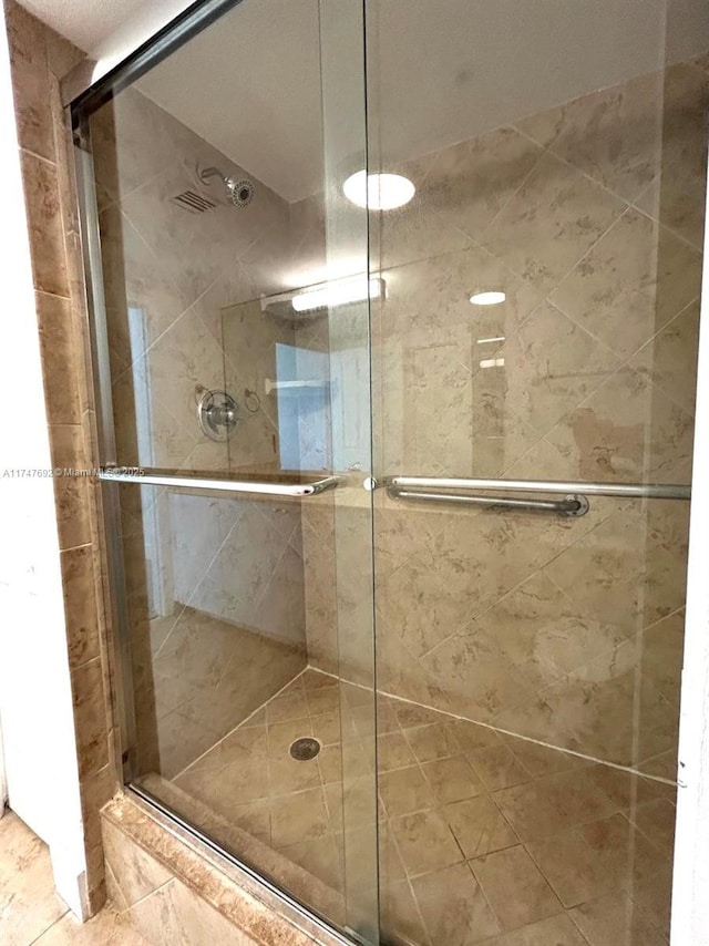 bathroom featuring a shower stall