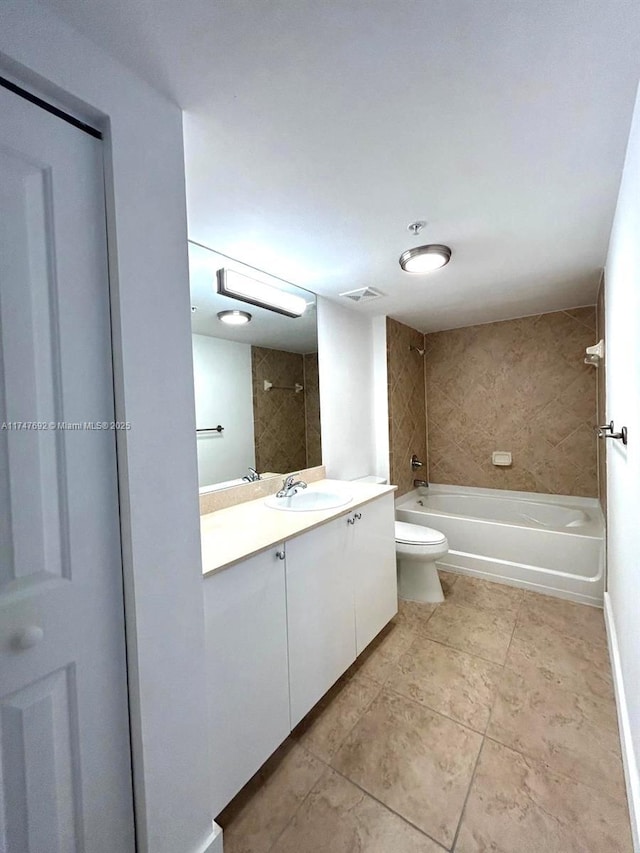 bathroom with visible vents, toilet, shower / bathtub combination, tile patterned floors, and vanity