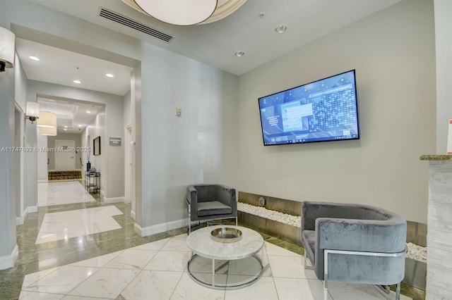 interior space featuring marble finish floor, baseboards, visible vents, and recessed lighting