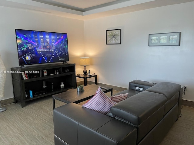 living room with wood finished floors and baseboards