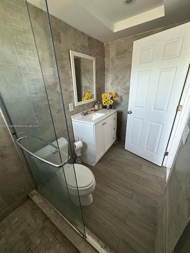 16900 NE 14th Ave Unit 209, Miami, FL 33162 - bathroom with toilet, tile walls, vanity, and a stall shower