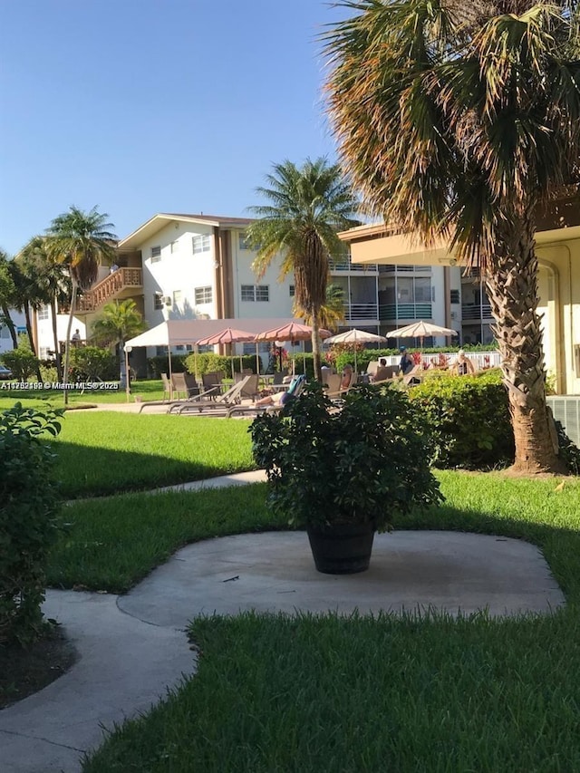 16900 NE 14th Ave Unit 209, Miami, FL 33162 - surrounding community with a lawn