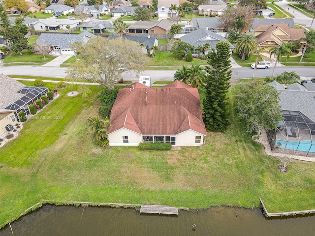 aerial view with a water view and a residential view