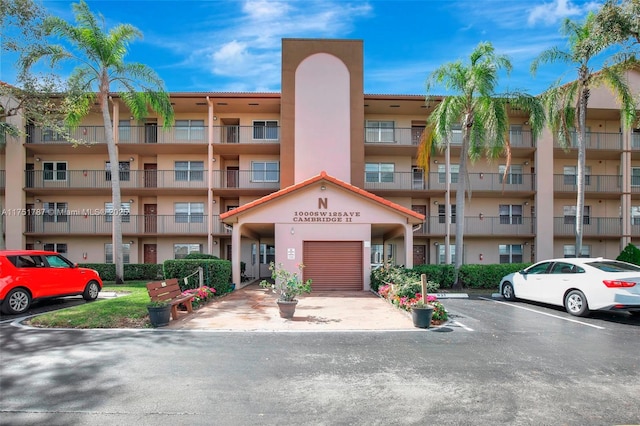 view of property with uncovered parking